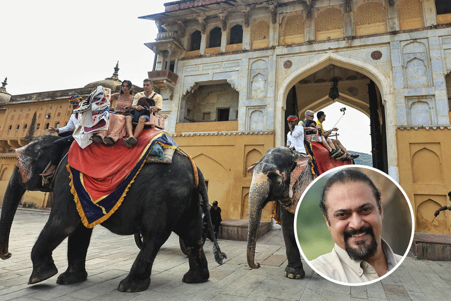 Tourists embark on elephant rides in front of Amer fort.