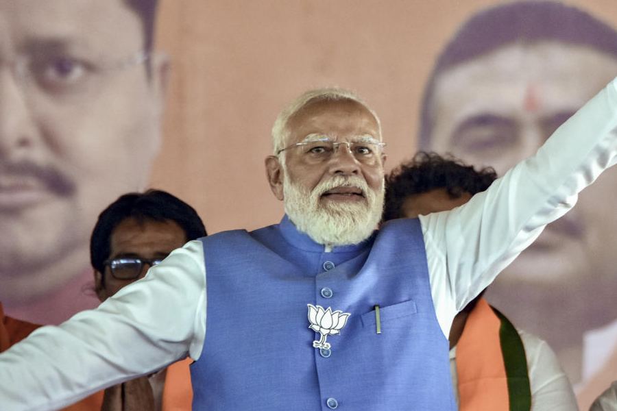 Prime Minister Narendra Modi greets during a public rally ahead of the West Bengal Assembly elections, in Jangipur, Murshidabad district, West Bengal, Saturday, April 11, 2026.