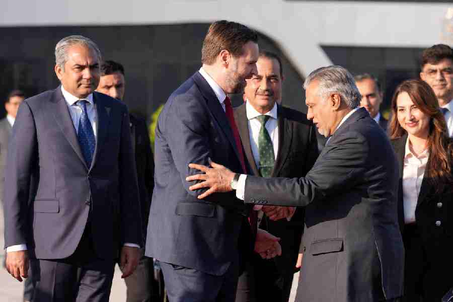 US Vice President JD Vance shakes hands with Pakistani Deputy Prime Minister and Foreign Minister Mohammad Ishaq Dar, as Vance prepares to board Air Force Two, after peace talks with Iran in Islamabad, Pakistan, Sunday, April 12, 2026.