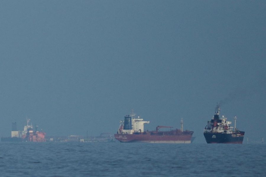 Oil tankers and cargo ships line up in the Strait of Hormuz as seen from Mina Al Fajer, United Arab Emirates, Wednesday, March 11, 2026.