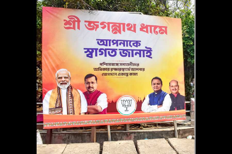 A BJP hoarding near the Puri sea beach.