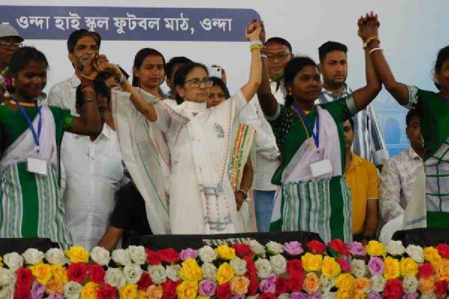 Mamata Banerjee dances with a tribal troupe at the end of her campaign rally in Bankura’s Onda. Picture by Rupesh Khan