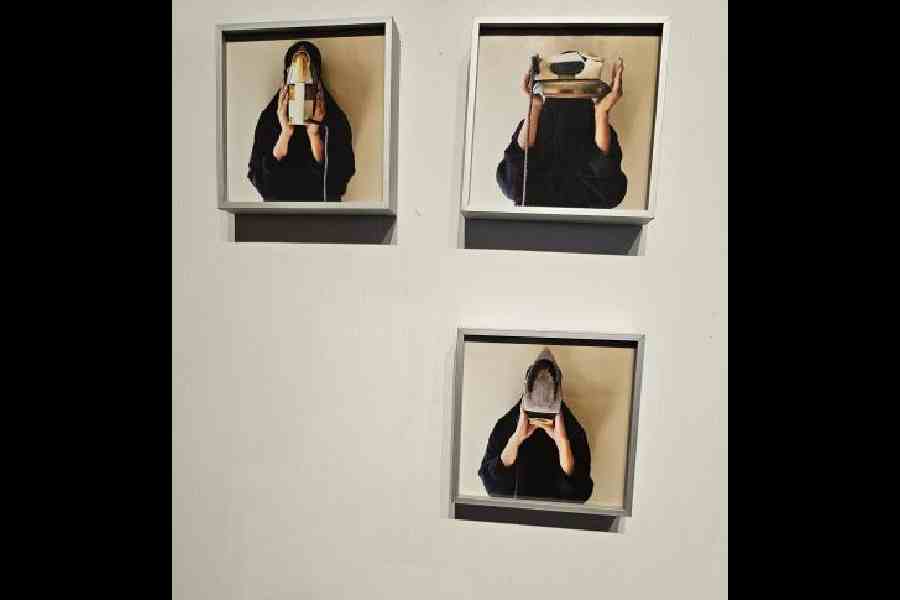 Three photos covering the face of the women with irons from the series Burqewali by Arshi Irshad Ahmadzai 