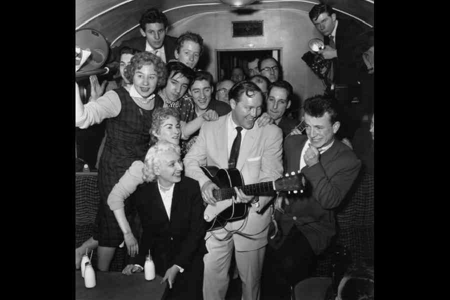 Bill Haley in a cramped railway carriage en route to London in February 1957. Picture: Getty Images