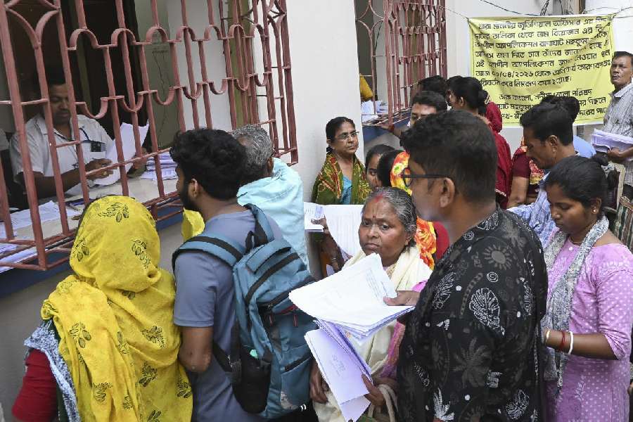 People wait to submit their petitions before the Special Tribunal after their names were deleted from the Special Intensive Revision final voter list ahead of West Bengal Assembly Election, at Ranaghat, in Nadia district, Wednesday, April 8, 2026.