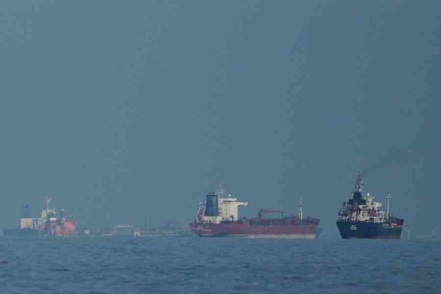 Oil tankers and cargo ships line up in the Strait of Hormuz as seen from Mina Al Fajer, United Arab Emirates, Wednesday, March 11, 2026.