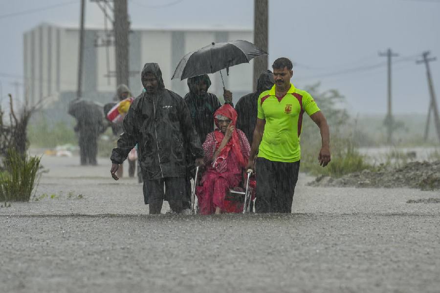 People being rescued from a flood-affected area amid rainfall, in view of Cyclone Ditwah, in Chennai, Wednesday, Dec. 3, 2025.