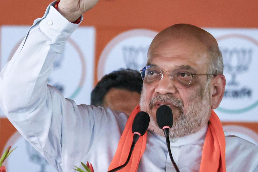 Union home minister Amit Shah addresses the gathering during an election campaign rally in support of BJP candidates ahead of West Bengal Assembly elections, at Kotasur in Birbhum district, Monday, April 13, 2026.