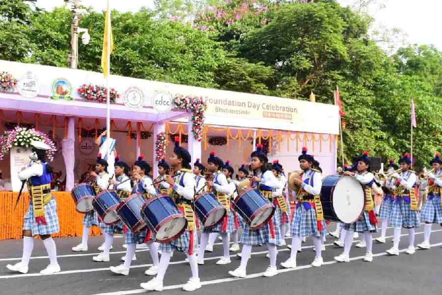 Students hold march-past during the foundation day celebrations in Bhubaneswar on Monday.