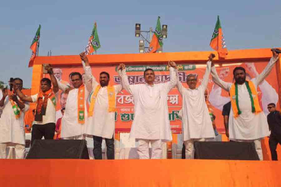 Suvendu Adhikari with other BJP leaders at a public meeting in Malda town’s Pallishri grounds on Monday. Picture by Soumya De Sarkar