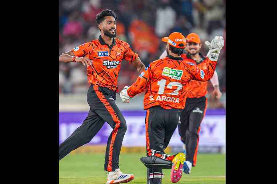 IPL debutant Praful Hinge celebrates with teammates after taking one of his four wickets in Sunrisers Hyderabad’s win against Rajasthan Royals on Monday. Fellow debutant Sakib Hussain also finished with four wickets.