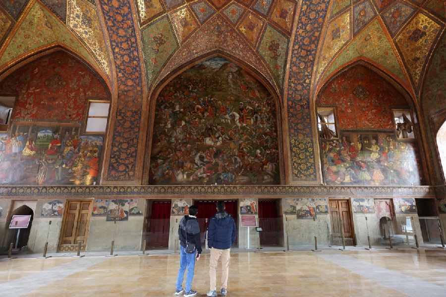 Visitors stand inside a historic building at Naqsh-e Jahan Square, a Unesco World Heritage site, in Isfahan, Iran, March 23, 2026. 
