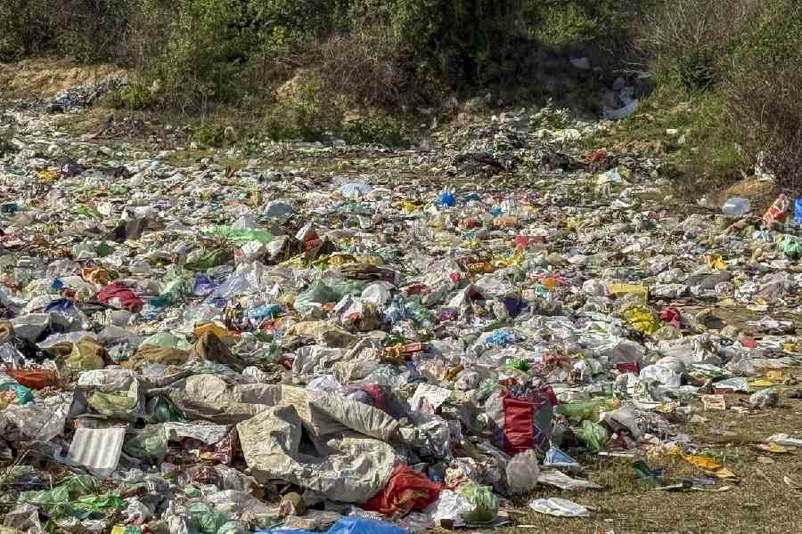 Garbage lies strewn across an open area in Loni, Ghaziabad, Monday, April 13, 2026.