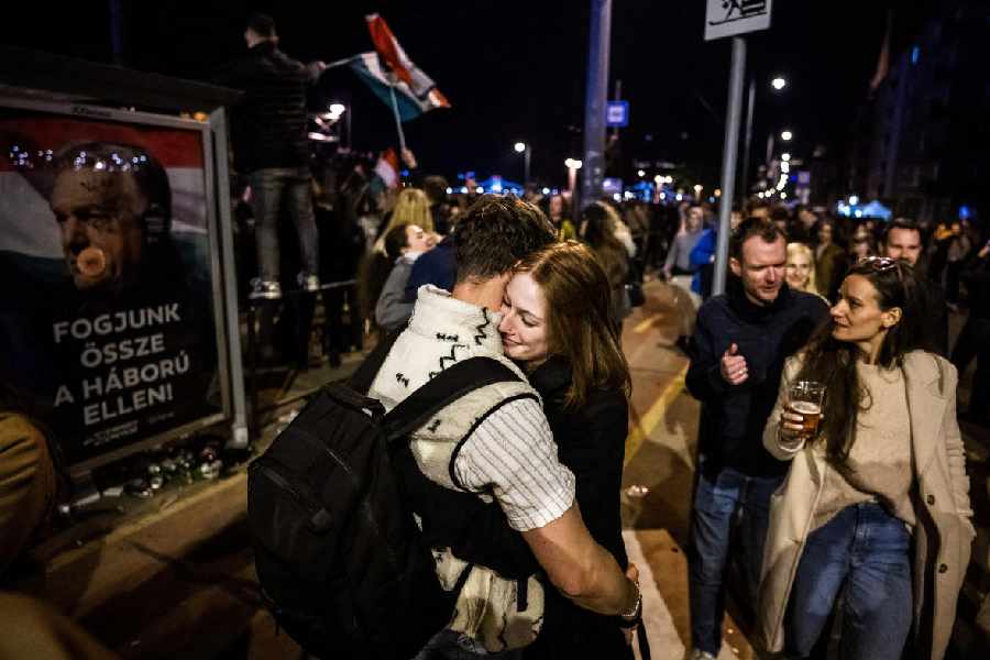 People celebrate after the Tisza Party wins the Hungarian parliamentary election in Budapest, Hungary, April 13, 2026.