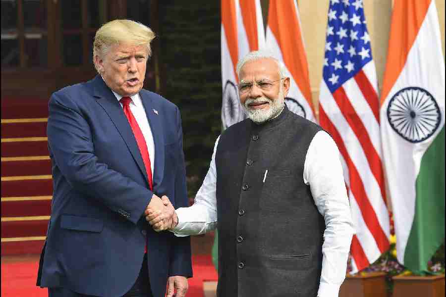 In this Feb. 25, 2020 file photo, Prime Minister Narendra Modi with US President Donald Trump at Hyderabad House, in New Delhi. US President Donald Trump on Wednesday, July 30, 2025 announced the imposition of a 25 per cent tariff on all goods coming from India starting August 1, plus an unspecified penalty for buying military equipment and crude oil from Russia.
