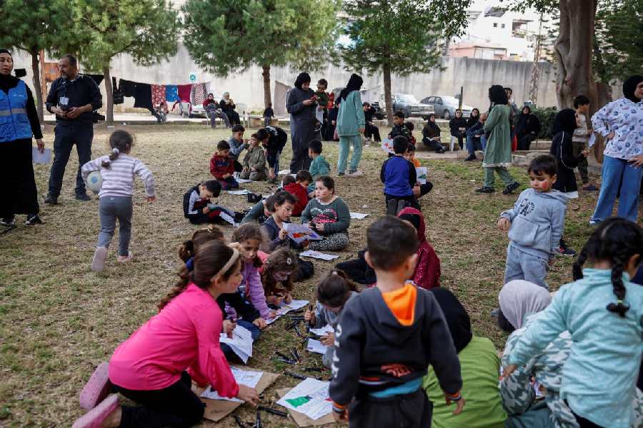 Displaced children take part in activities organised by Takatafo Campaign and supported by psychologists, to entertain and to mentally support displaced children, in a shelter in Tyre, south Lebanon, April 14, 2026.