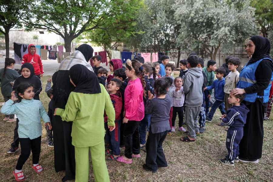 Displaced children take part in activities organised by Takatafo Campaign and supported by psychologists, to entertain and to mentally support displaced children, in a shelter in Tyre, south Lebanon, April 14, 2026.