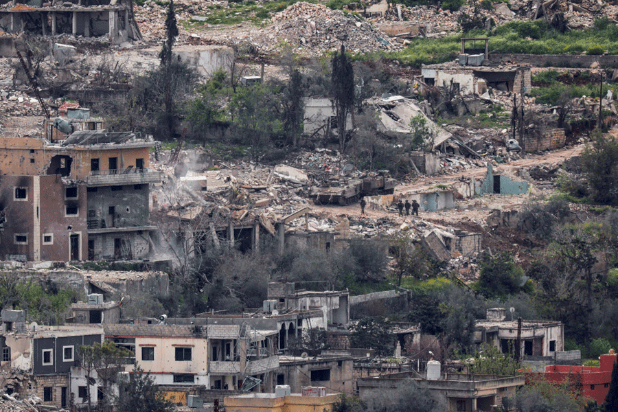 Israeli soldiers walk among destroyed buildings in southern Lebanon, near the Israel-Lebanon border, as seen from the Israeli side of the border in northern Israel, April 14, 2026.