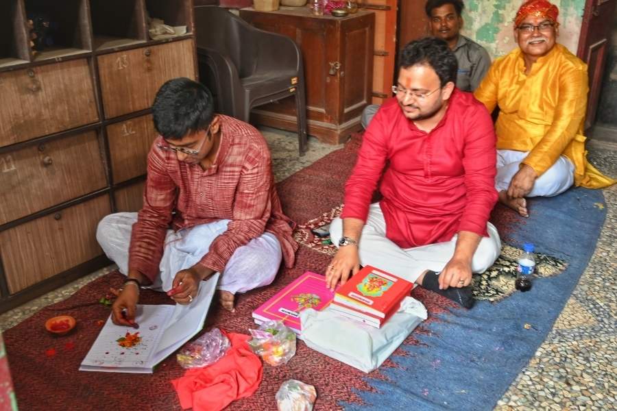 Inside a modest shop near Kalighat, pages to a new year were turned and inked with prayer. 
