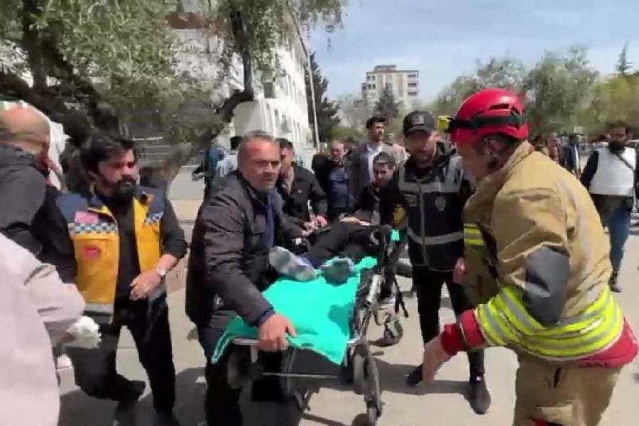 An injured person is carried to an ambulance following a school shooting, in the southeastern province of Kahramanmaras, Turkey, April 15, 2026.