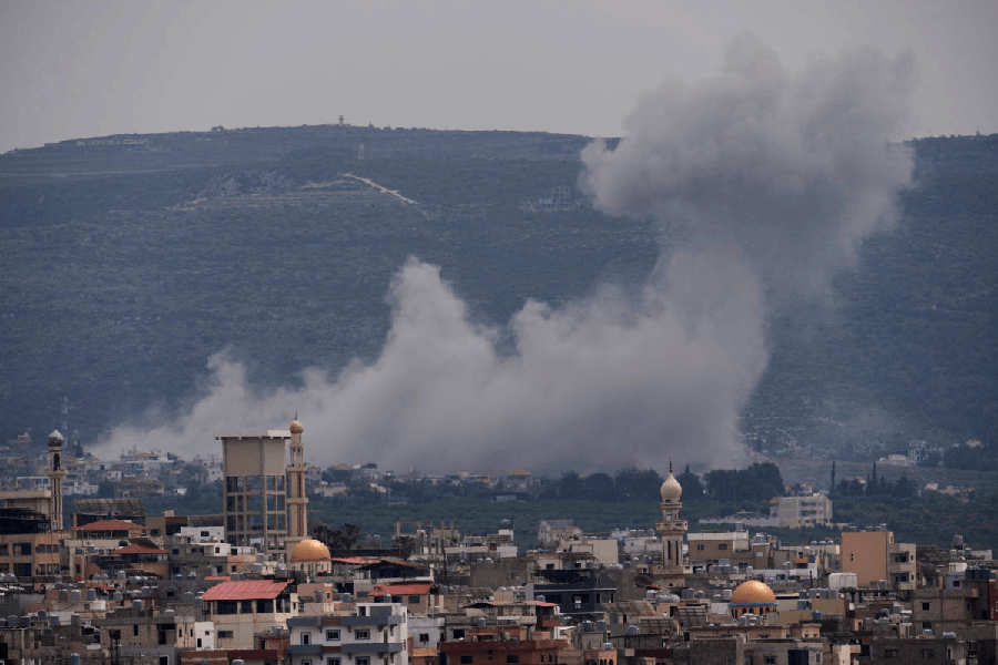 Smoke rises following an Israeli airstrike on the village of Qlaileh, as seen from the southern port city of Tyre, Lebanon, Wednesday, April 15, 2026.