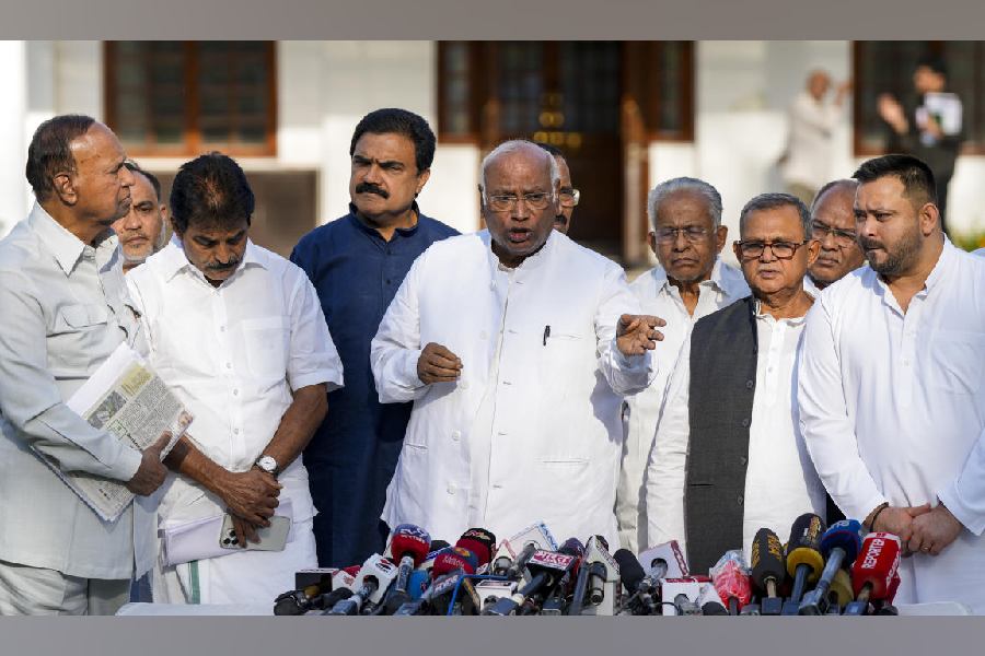 Congress President Mallikarjun Kharge addresses a press conference after a meeting between INDIA bloc leaders, in New Delhi, Wednesday, April 15, 2026. DMK leader TR Baalu, RJD leader Tejashwi Yadav and Congress leaders KC Venugopal and Jairam Ramesha are also seen.