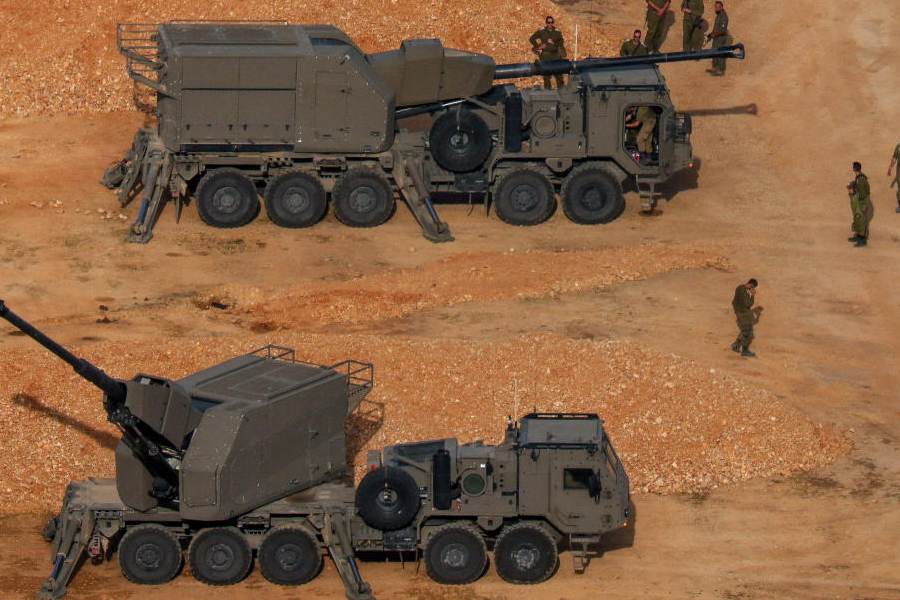 Israeli soldiers next to artillery vehicles near the Israel-Lebanon border, in northern Israel, April 15, 2026.