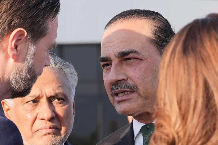 Pakistan's Chief of Defence Forces and Chief of Army Staff Field Marshall Asim Munir, right, talks to Vice President JD Vance as Pakistani Deputy Prime Minister and Foreign Minister Mohammad Ishaq Dar, left, listens before Vance boards Air Force Two after attending talks on Iran in Islamabad, Pakistan, Sunday, April 12, 2026.