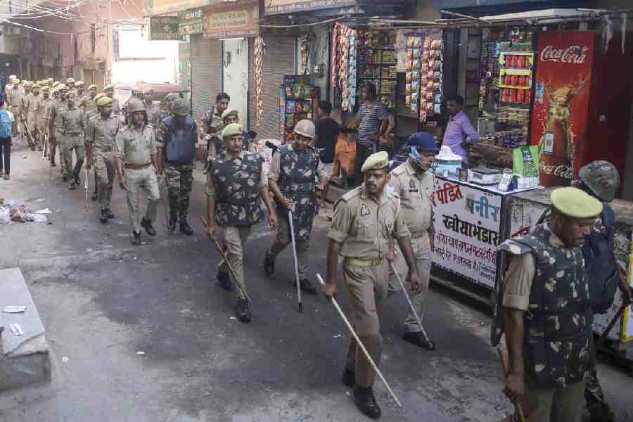 Police personnel conduct a route march