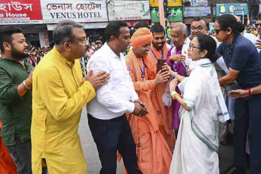 Mamata Banerjee interacts with people in Siliguri on Wednesday while campaigning ahead of the Assembly elections.