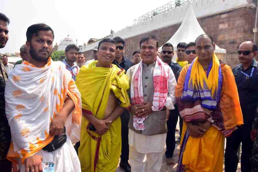 Himanta Biswa Sarma and his companions near Puri temple