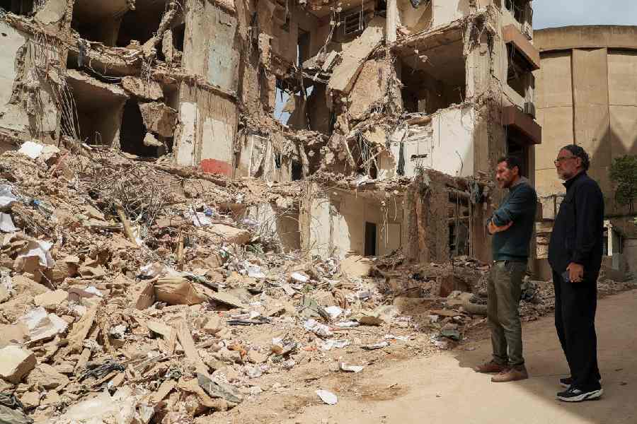 Wael and Ali Sabbagh, whose mother Afaf Sidaoui and brother Hassan were killed in an Israeli strike on an apartment building on April 8, stand at the strike site in Tallet El Khayat in Beirut, Lebanon, April 15, 2026.