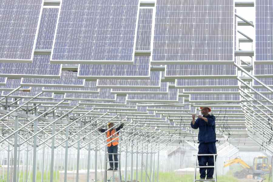 Workers install solar panels in Lianyungang, Jiangsu province, China May 15, 2018.