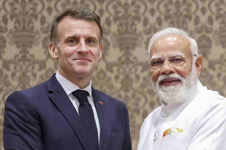 Prime Minister Narendra Modi with French President Emmanuel Macron during a joint press meet, in Mumbai.
