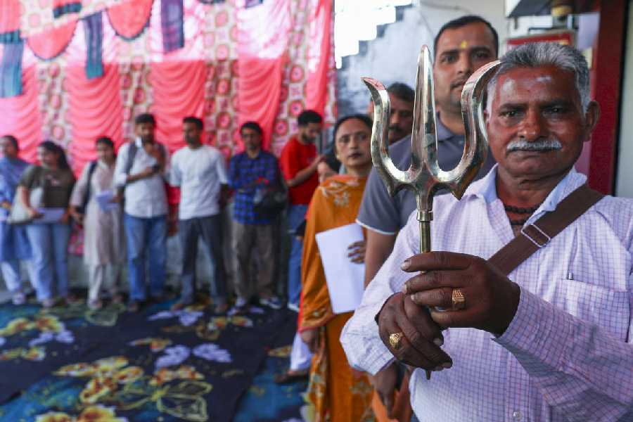 People queue up during registration for the annual Amarnath Yatra, in Jammu, Wednesday, April 15, 2026.