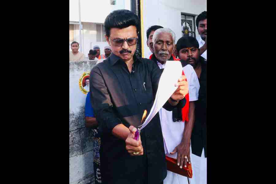 Tamil Nadu chief minister MK Stalin burns a copy of the delimitation bill during a protest in Namakkal on Thursday.