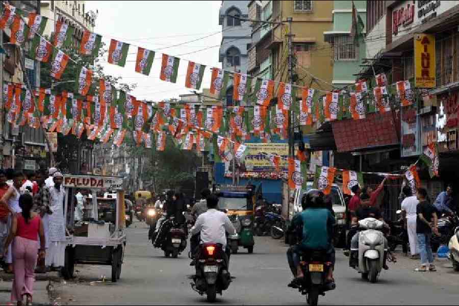 Party flags strung across a road in Metiabruz on Thursday