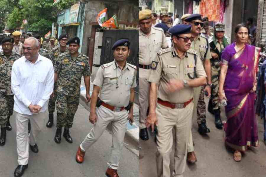 Randhir Kumar, DEO, Calcutta South, in Kidderpore on Thursday. Smita Pandey, DEO of Calcutta North, and police officers on a visit on Thursday