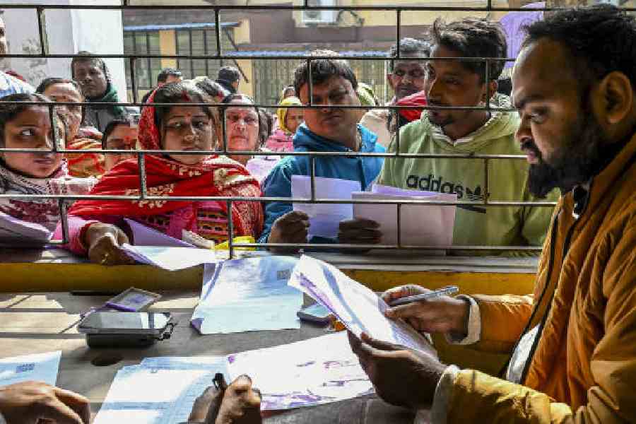 People assemble to get their documents verified as a part of an SIR hearing in Nadia in February this year