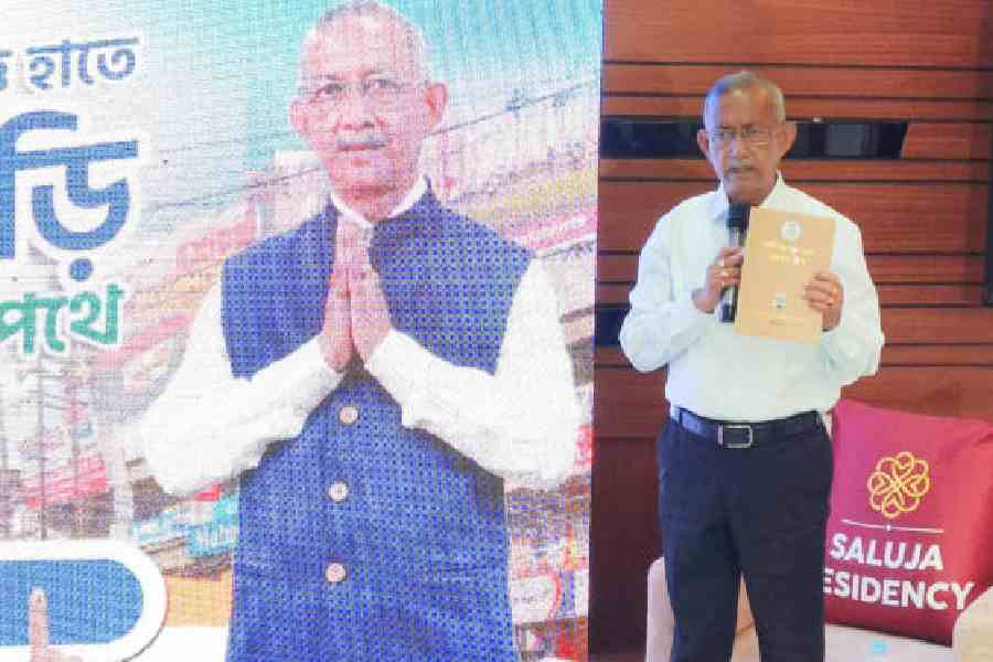 Gautam Deb launches a book on Siliguri’s history at a banquet hall in the town on Thursday. Picture by Passang Yolmo