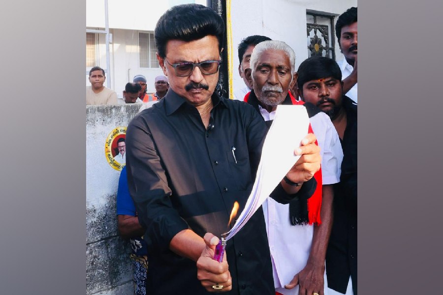 Tamil Nadu Chief Minister MK Stalin burns a copy of the proposed Delimitation bill during a protest, in Namakkal, Tamil Nadu