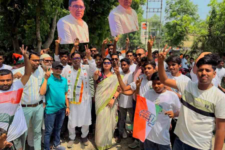 Abdul Hannan, the Congress candidate from Sujapur, campaigns with his cutouts and party supporters in Malda district on Wednesday. Picture by Soumya De Sarkar