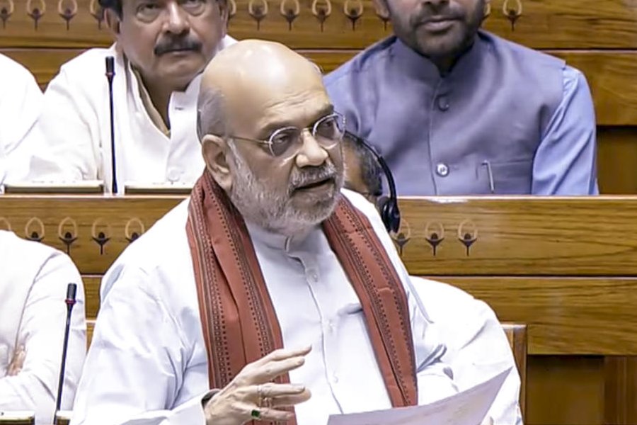 Union Home Minister Amit Shah speaks in the Lok Sabha during the Special session of Parliament, in New Delhi, Thursday, April 16, 2026.
