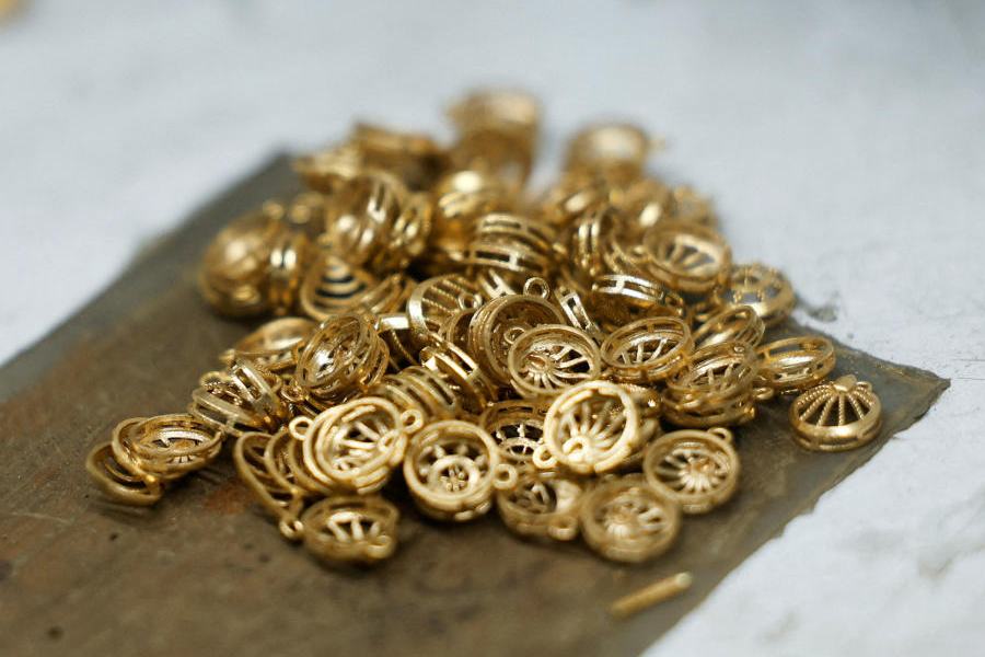 Gold ornaments are placed for polishing inside a Senco Gold & Diamonds jewellery workshop in Kolkata, India, January 29, 2026.