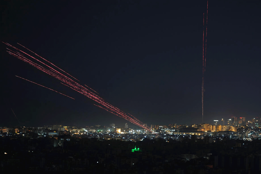 Tracer rounds illuminate the night sky as people fire live ammunition and fireworks into the air following a ceasefire between Israel and Hezbollah, in Beirut, Lebanon, early Friday, April 17, 2026.