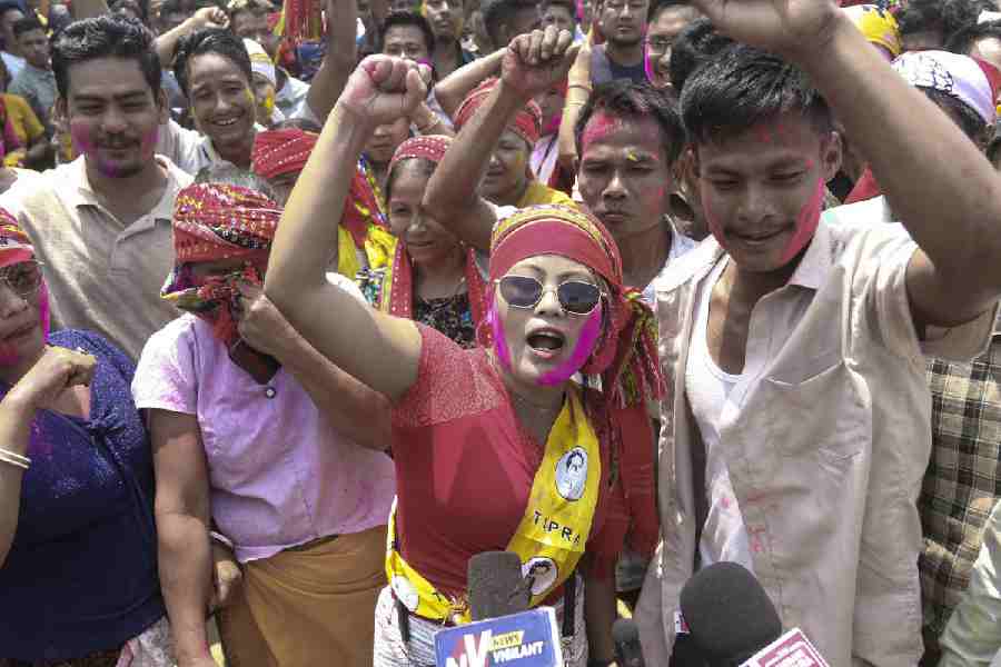 Supporters of Tipra Motha Party (TMP) celebrate as they emerge as the frontrunners, with a lead in 22 out of 28 seats after the third round the counting of votes in the Tripura Tribal Areas Autonomous District Council (TTAADC) elections, at Jarnia, in Tripura, Agartala, Friday, April 17, 2026.