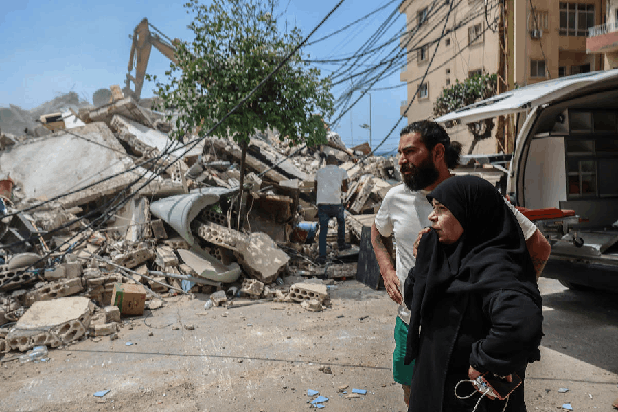 A woman reacts as emergency personnel search for survivors at the site of an Israeli strike carried out just before a 10-day ceasefire between Lebanon and Israel, in Tyre, Lebanon, April 17, 2026.