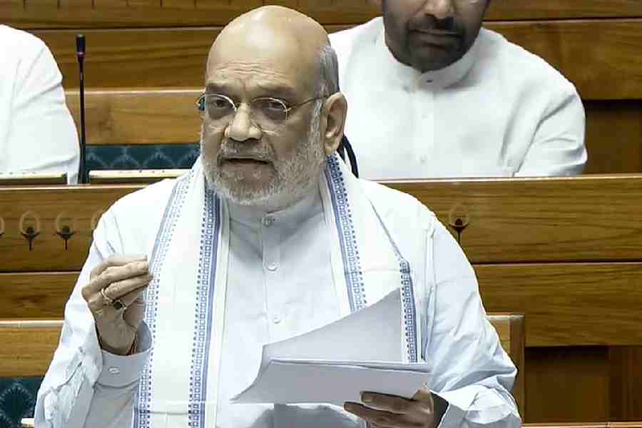 Union Home Minister Amit Shah speaks in the Lok Sabha during the Special session of Parliament, in New Delhi, Friday, April 17, 2026.