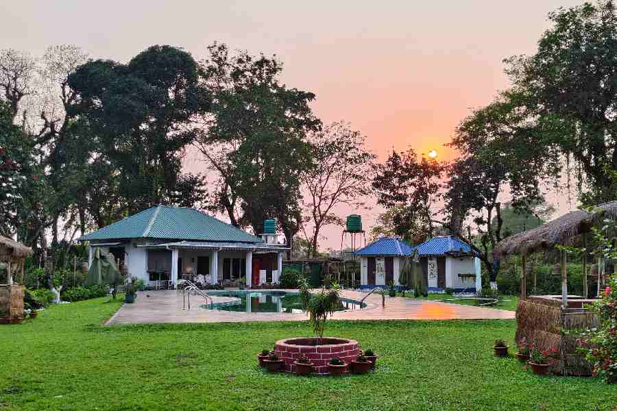 The tea tourism lodge includes mordern facilities like swimming pool and bar.