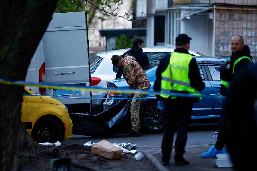 The body of a victim is carried, at the site of a shooting incident, in Kyiv, Ukraine, April 18, 2026.
